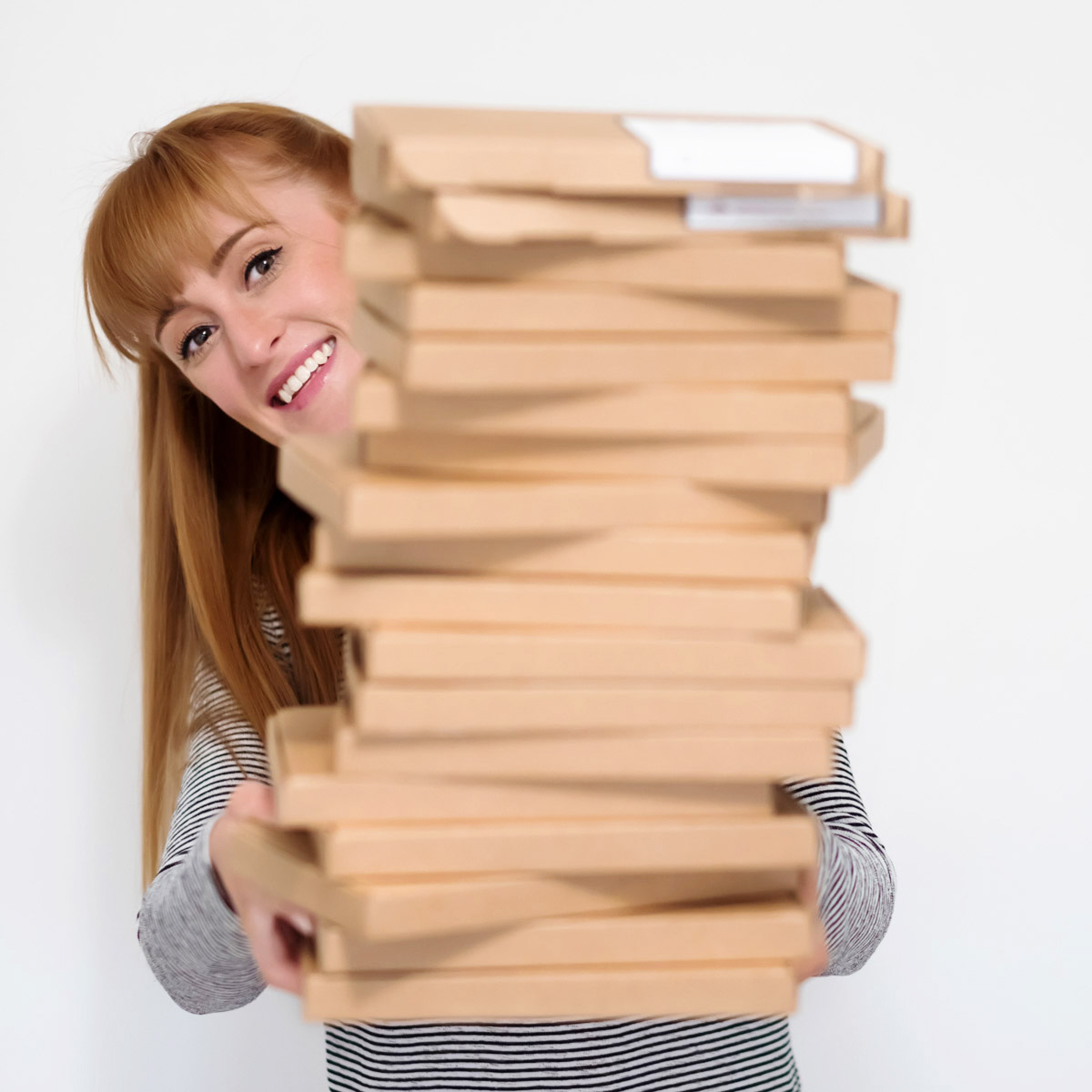 business owner holding packaged boxes captured by business photographer Spotlight Lane in Nottingham