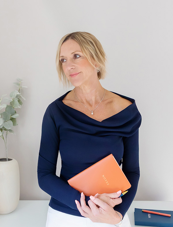 female seo and website consultant at spotlight lane nottingham with notebook